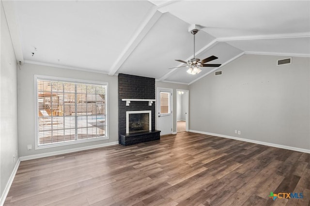 116 Guinevere St, Victoria, TX 77904 - unfurnished living room with a brick fireplace, vaulted ceiling, ceiling fan, and hardwood / wood-style flooring