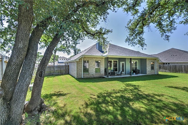 6129 Messina Dr, Temple, TX 76502 - back of house with brick siding, a fenced backyard, a patio, and roof with shingles