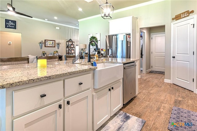 6129 Messina Dr, Temple, TX 76502 - kitchen featuring stainless steel appliances, crown molding, white cabinets, pendant lighting, and recessed lighting