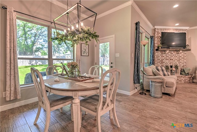 6129 Messina Dr, Temple, TX 76502 - dining area with plenty of natural light, crown molding, wood finished floors, a chandelier, and recessed lighting