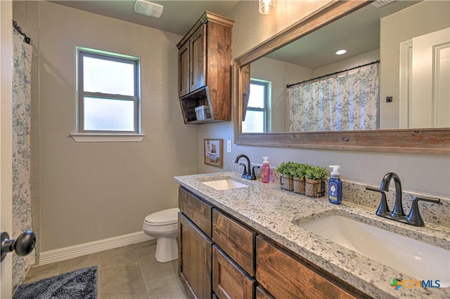 6129 Messina Dr, Temple, TX 76502 - full bath featuring double vanity, tile patterned flooring, and curtained shower