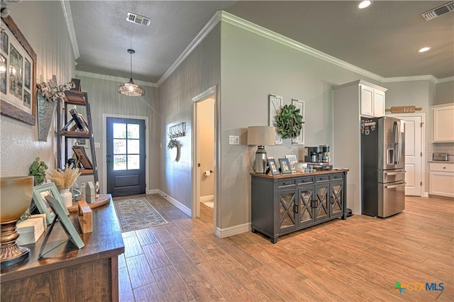 6129 Messina Dr, Temple, TX 76502 - entrance foyer with light wood-style flooring, crown molding, and recessed lighting