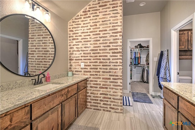 6129 Messina Dr, Temple, TX 76502 - full bath with vanity, vaulted ceiling, and a walk in closet