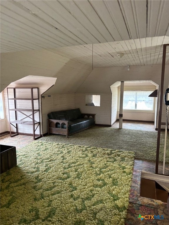 additional living space with lofted ceiling, carpet, and wood ceiling