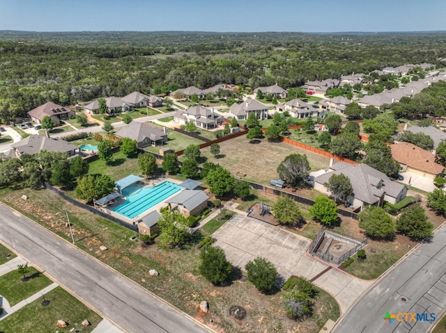 bird's eye view featuring a residential view and a view of trees