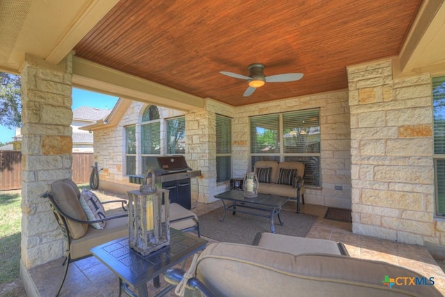 view of patio / terrace featuring grilling area, ceiling fan, fence, and an outdoor hangout area