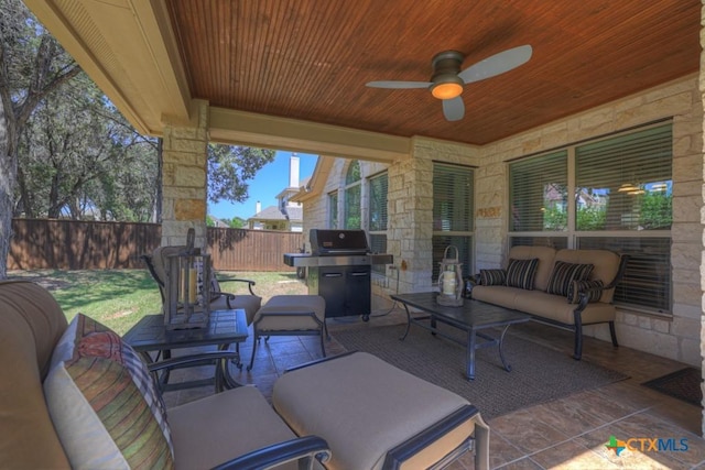 view of patio featuring an outdoor living space, fence, ceiling fan, and a grill