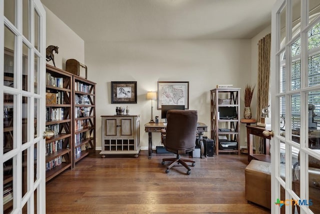 office area with french doors and wood finished floors
