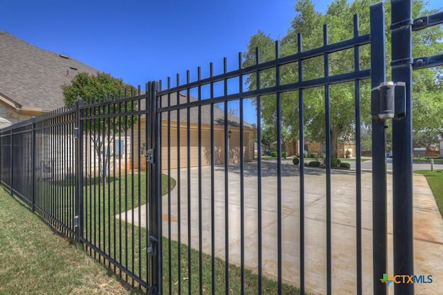 view of gate with fence