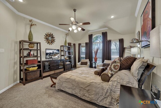 bedroom with baseboards, ornamental molding, a ceiling fan, lofted ceiling, and carpet