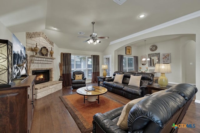 living room featuring visible vents, arched walkways, dark wood-style flooring, ceiling fan, and vaulted ceiling