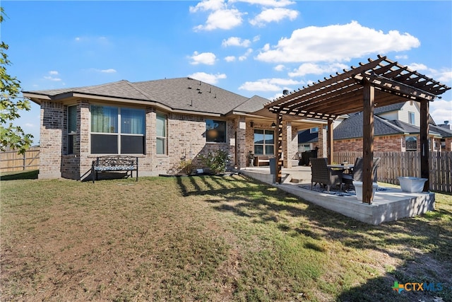 back of property with a lawn, a pergola, and a patio