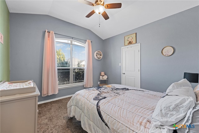 carpeted bedroom with ceiling fan and vaulted ceiling