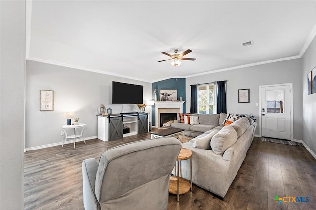 5502 Kent Dr, Belton, TX 76513 - living area with ornamental molding, a ceiling fan, wood finished floors, and a tile fireplace