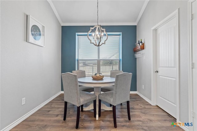 5502 Kent Dr, Belton, TX 76513 - dining area featuring a chandelier, crown molding, and wood finished floors