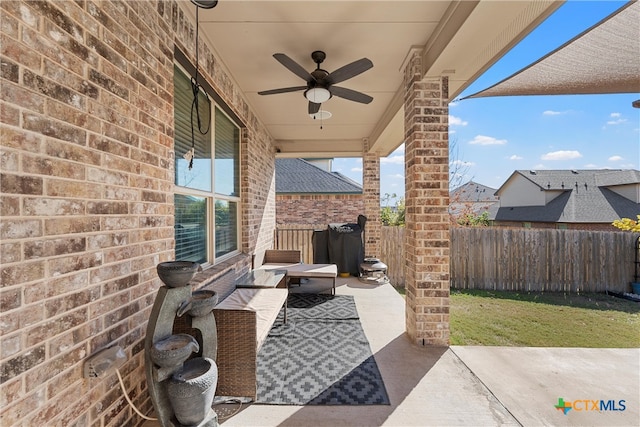 view of patio featuring ceiling fan