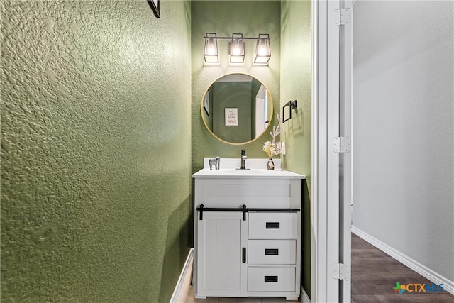 bathroom featuring vanity and hardwood / wood-style flooring