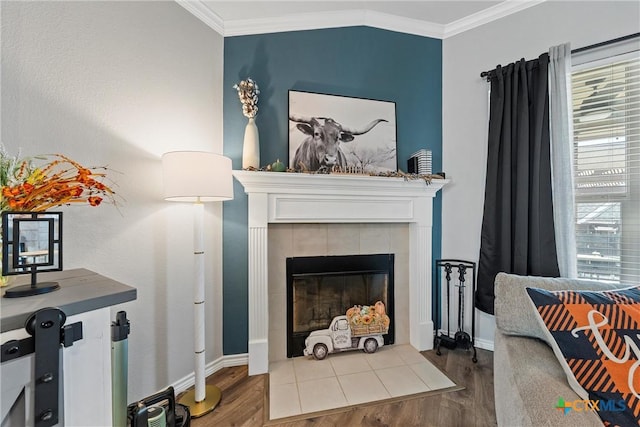 5502 Kent Dr, Belton, TX 76513 - living area featuring ornamental molding, wood finished floors, and a tile fireplace