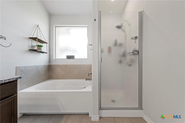 5502 Kent Dr, Belton, TX 76513 - full bathroom featuring a shower stall, a garden tub, tile patterned floors, and vanity