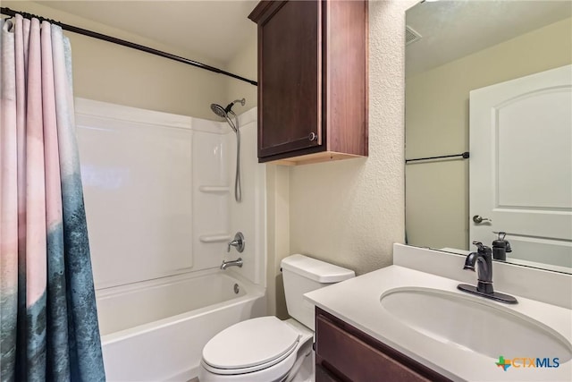 full bathroom featuring vanity, toilet, and shower / bath combo with shower curtain