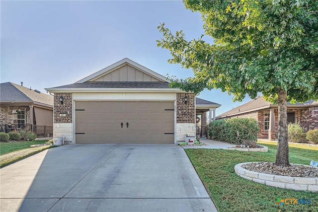 single story home featuring a garage and a front lawn