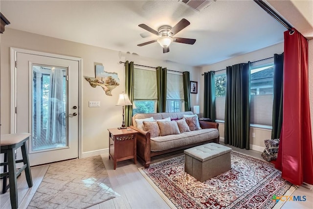 sitting room featuring ceiling fan