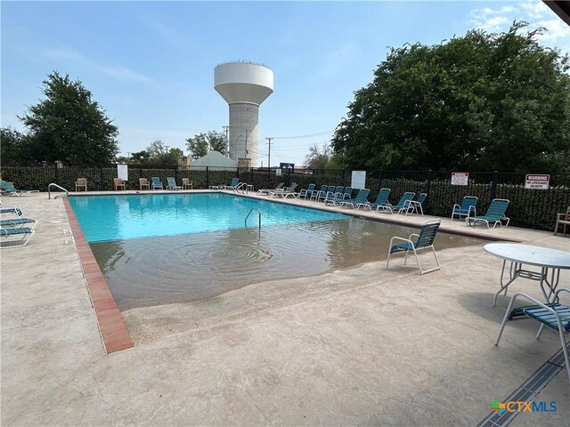 3608 Space Cloud Dr, New Braunfels, TX 78130 - community pool featuring a patio area