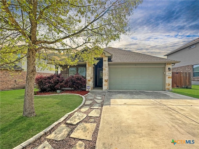 2134 Dove Crossing Dr, New Braunfels, TX 78130 - single story home with a garage, stone siding, a front lawn, a shingled roof, and concrete driveway
