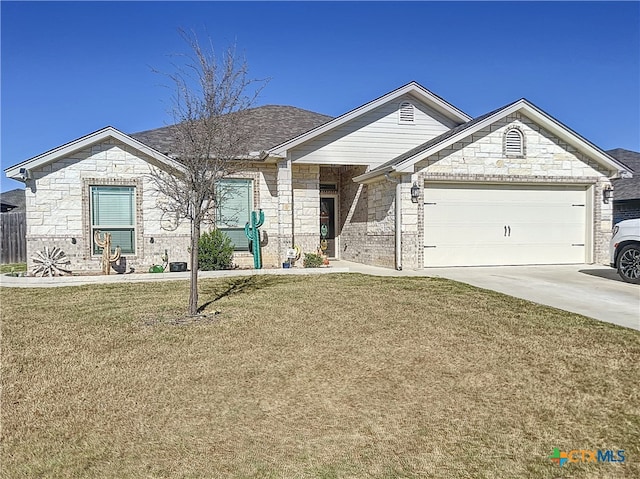 view of front of house featuring a garage and a front lawn