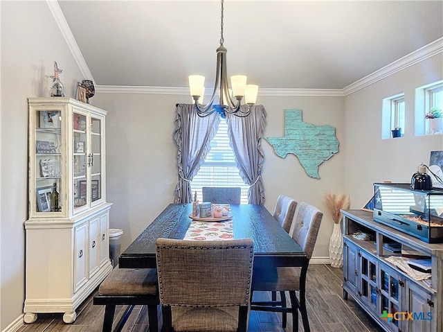 dining area with dark wood-type flooring, an inviting chandelier, and crown molding