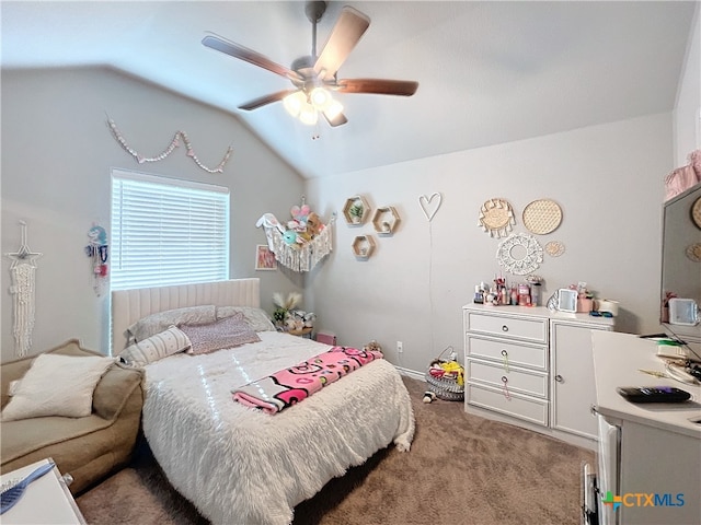 carpeted bedroom with ceiling fan and vaulted ceiling