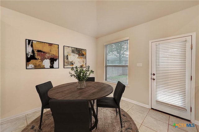 834 Oyster Crk, Buda, TX 78610 - dining area with light tile patterned floors and baseboards