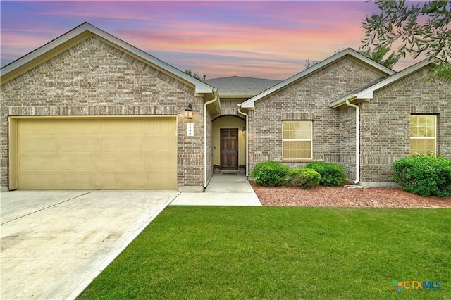 834 Oyster Crk, Buda, TX 78610 - single story home featuring a front lawn, an attached garage, driveway, and brick siding