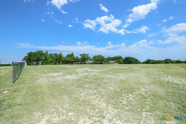 view of yard with a rural view