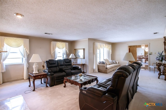 living room featuring a textured ceiling and light carpet