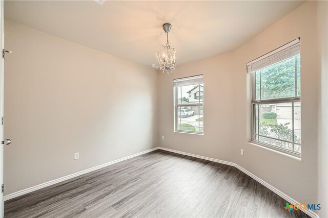 19308 Nicole Ln, Pflugerville, TX 78660 - unfurnished room featuring light wood-style floors, a ceiling fan, and baseboards