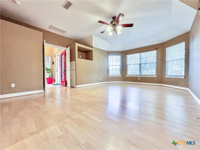 spare room featuring ceiling fan and light hardwood / wood-style flooring