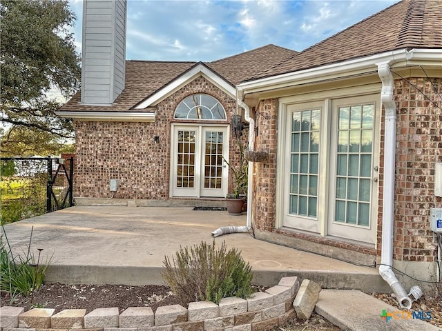 doorway to property with a patio area and french doors