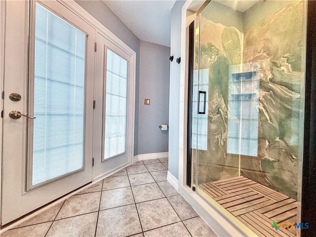 bathroom with tile patterned floors and a wealth of natural light