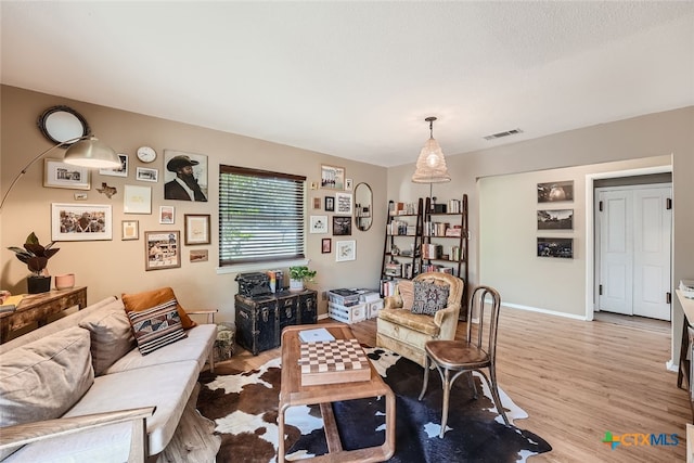 living room with light hardwood / wood-style floors