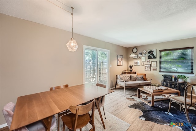 dining area with light wood-type flooring