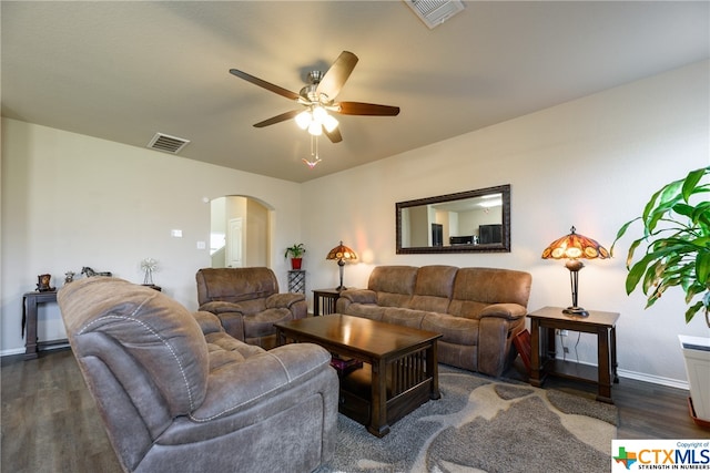 living room featuring dark hardwood / wood-style floors and ceiling fan