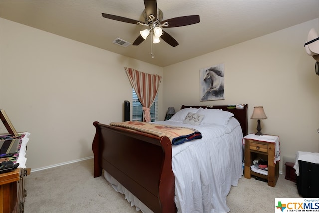 bedroom featuring light carpet and ceiling fan