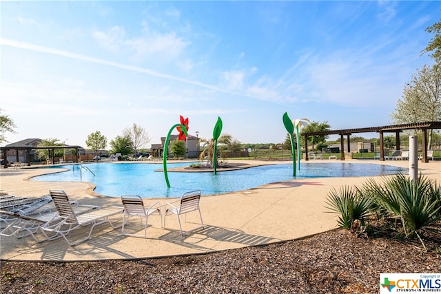 view of swimming pool featuring a patio area and pool water feature