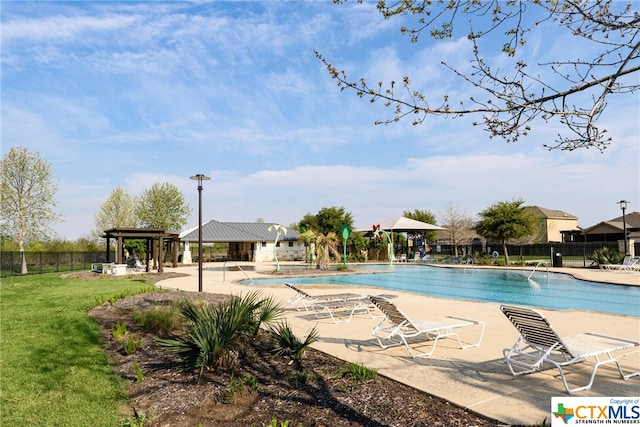 view of swimming pool featuring a patio, a yard, and a gazebo