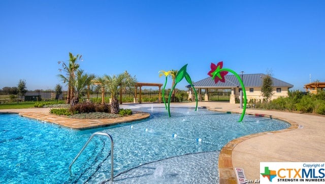 view of swimming pool featuring a patio area