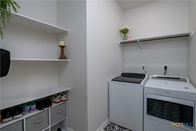 laundry area featuring laundry area, separate washer and dryer, and baseboards