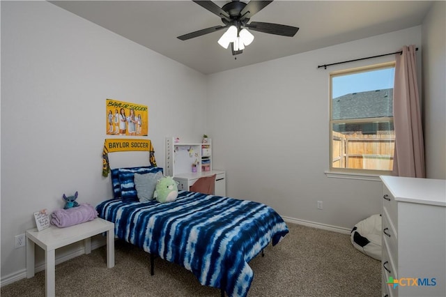 carpeted bedroom featuring a ceiling fan and baseboards