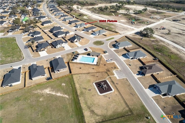 birds eye view of property with a residential view