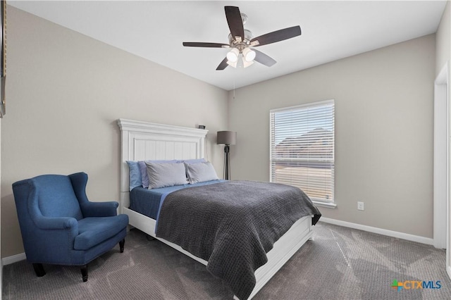 carpeted bedroom featuring ceiling fan and baseboards